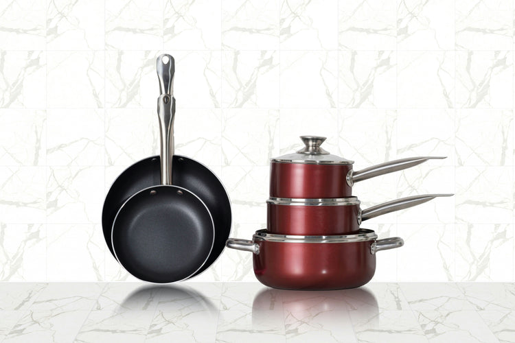 Non-stick frying pans and stackable red cookware set with lids, perfect for versatile cooking in any kitchen