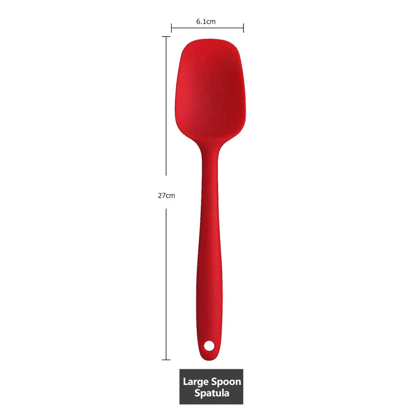 Measurement of a large red silicone spoon spatula, 27 cm in length with a 6.1 cm wide head.