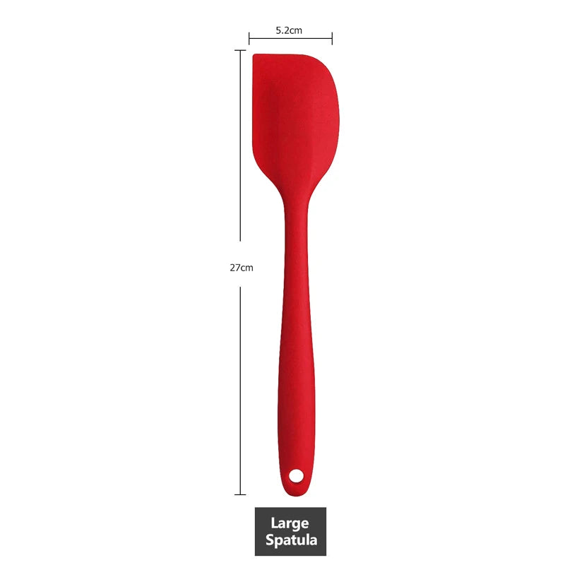 "Measurement of a large red silicone spatula, 27 cm in length with a 5.2 cm wide head.