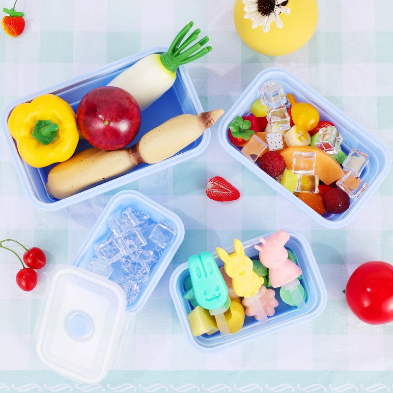 colourful collapsible silicone food storage container in  blue, ideal for saving space and keeping food fresh. Container with chopped fresh fruit and vegetables.